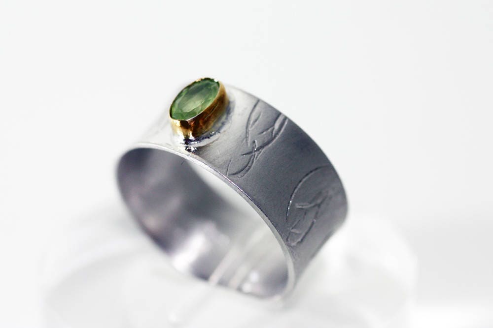 Peridot on Silver ring with gold K14 bezel