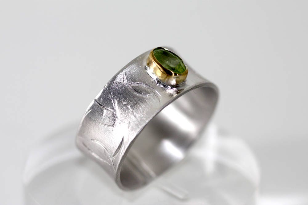 Peridot on Silver ring with gold K14 bezel