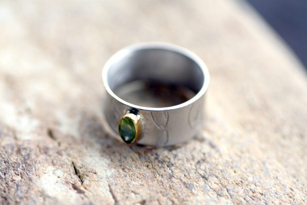 Peridot on Silver ring with gold K14 bezel