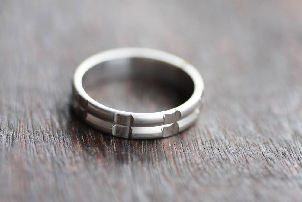 Solid gold or sterling silver wedding ring with simple lines