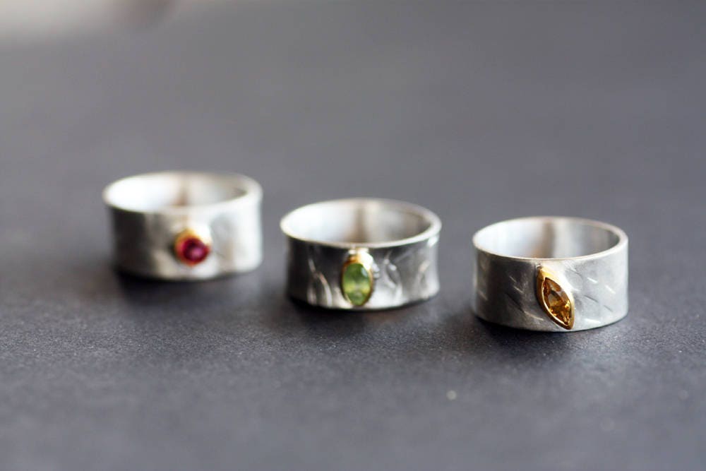 Peridot on Silver ring with gold K14 bezel