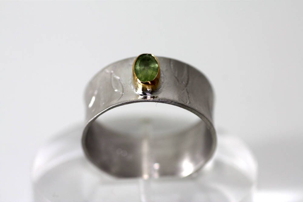 Peridot on Silver ring with gold K14 bezel