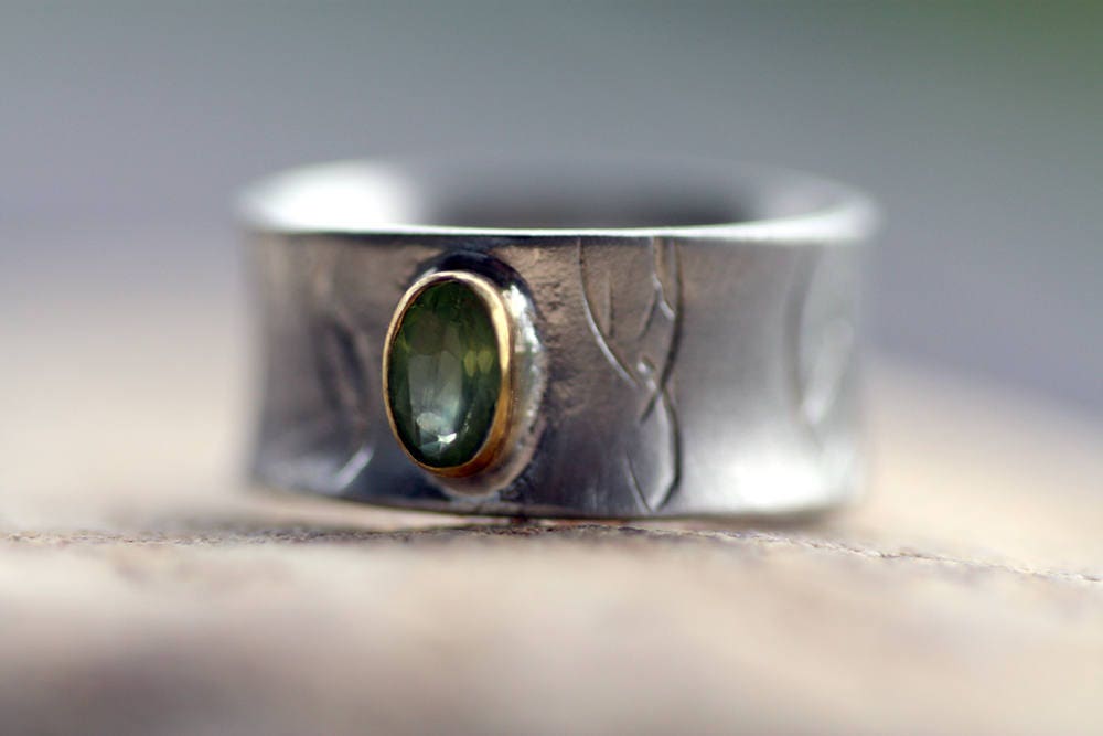 Peridot on Silver ring with gold K14 bezel