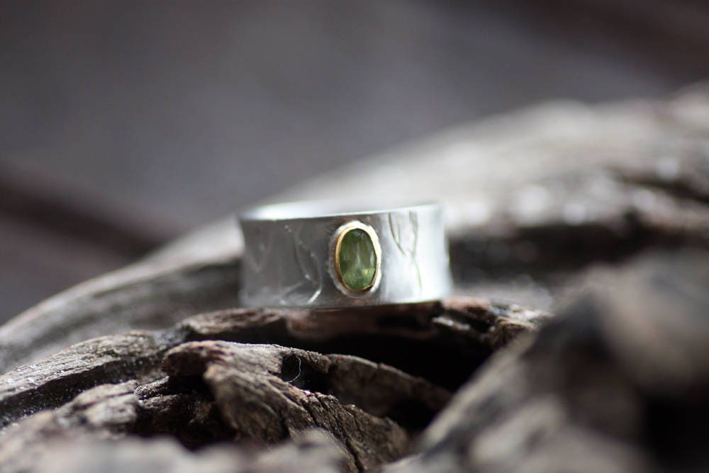 Peridot on Silver ring with gold K14 bezel