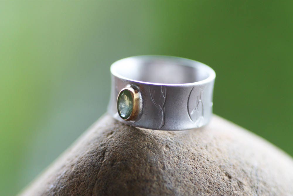 Peridot on Silver ring with gold K14 bezel