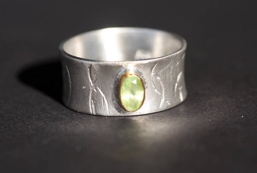 Peridot on Silver ring with gold K14 bezel