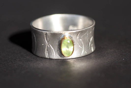 Peridot on Silver ring with gold K14 bezel