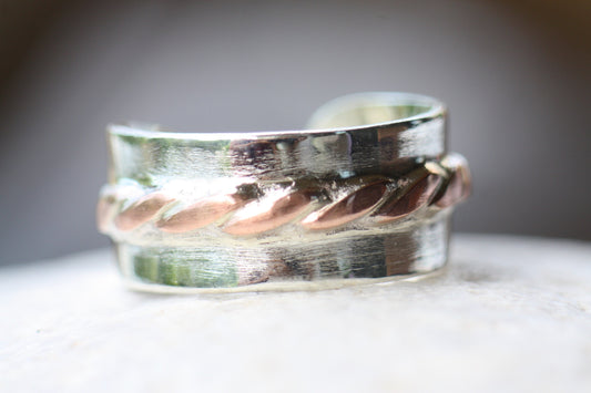 Adjustable silver ring with copper braid