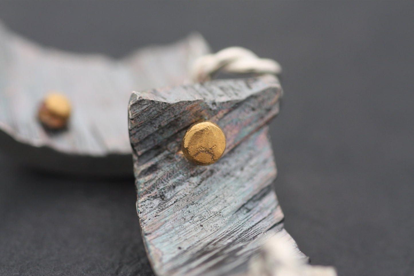 Silver pendant with gold details