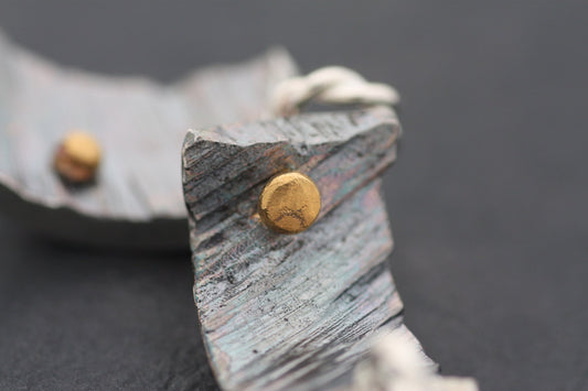 Silver pendant with gold details