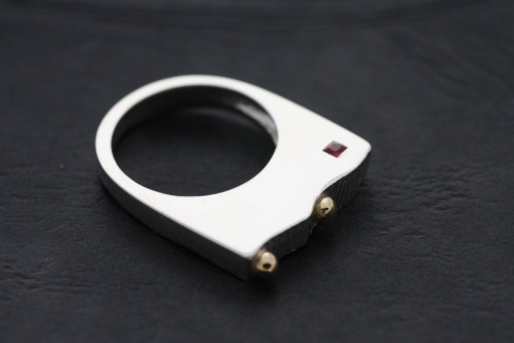 Sterling Silver ring with Gold details and a fine princess cut Ruby