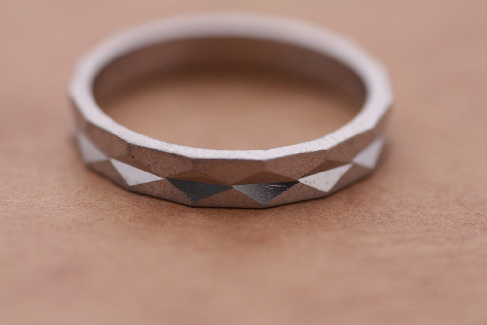 Faceted gold wedding band