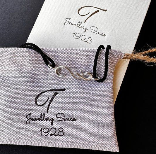 elebrate the New Year with a silver lucky charm necklace and bracelet. A simple, meaningful gift for everyone.