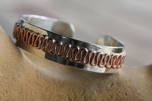 This is silver cuff with copper details, a wavy design on a rustic mens jewellery, ideal gift for him