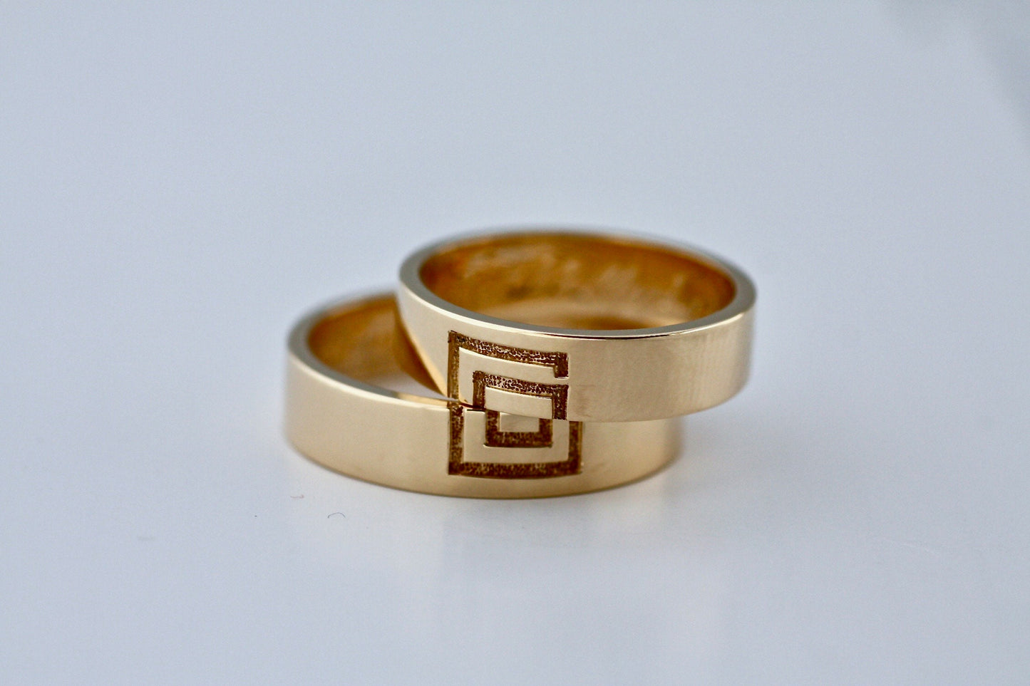 Meander sign Gold wedding bands for couples